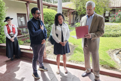 Brig. Gen. Jay Bullard, USMC (Ret) reading Certificate of Achievement to Ernesto and Claudia Villalobos on behalf of their son, Isaí Villalobos